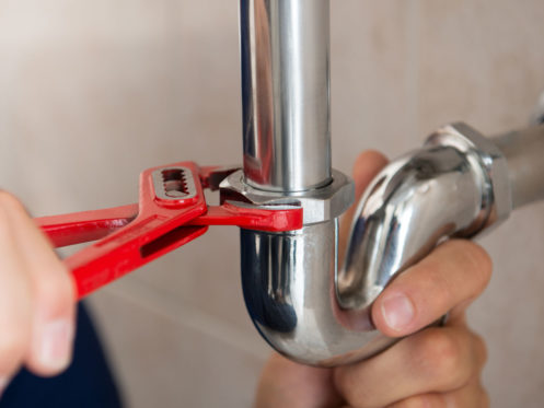 Man fixing pipe in Midvale, UT